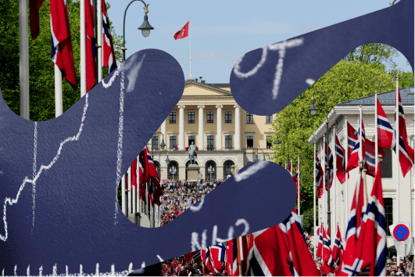 Bilde av et barnetog som går oppover en gate mot et slott 