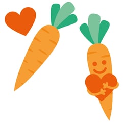To gulerøtter med smilefjes og hjerte