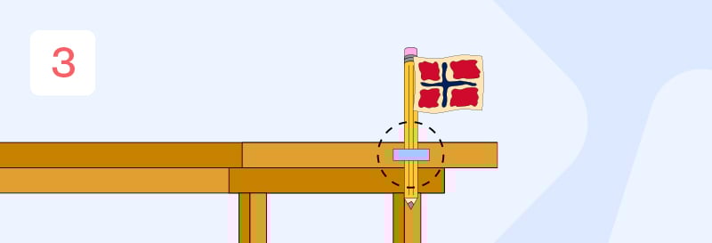 En gul gråblyant som blir festet til enden av et bord med klar teip